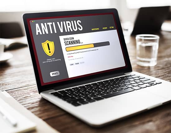 An image featuring a laptop that has an antivirus scan on it