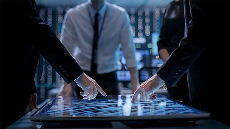 An image featuring multiple people having a discussion representing surveillance state