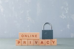 An image featuring cool puzzle blocks that say online privacy on them with a lock on top of them representing online privacy concept
