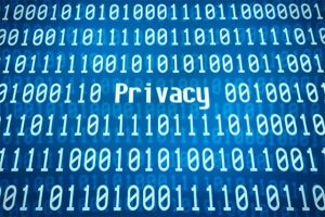 An image featuring a cool blue background with text in the middle that says privacy and binary code next to it representing electronic privacy