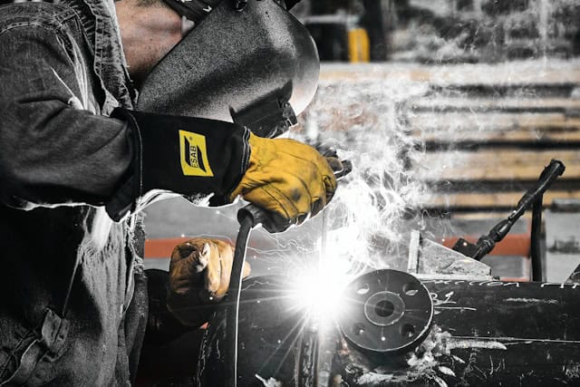 man working on metal